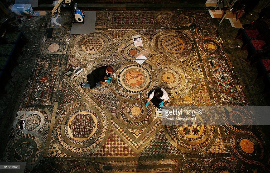 London, 2008. Centuries of dirt and grime will be painstakingly removed from this work of medieval craftsmanship during a £535,000 restoration project. The 56 sq/m intricate mosaic floor lies in front of High Altar. Long hidden under rolls of carpet - it is made from small inlaid pieces of semi-precious stone, marble, glass and metal set in squares and circles some of which is thought to have been recycled from the ruins of ancient Rome. Commissioned by Henry III to be a centrepiece of the re-built 13th century Abbey.